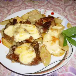 Пържоли на фурна с картофи и топено сирене