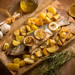 Лаврак на фурна с картофи, лимон и розмарин